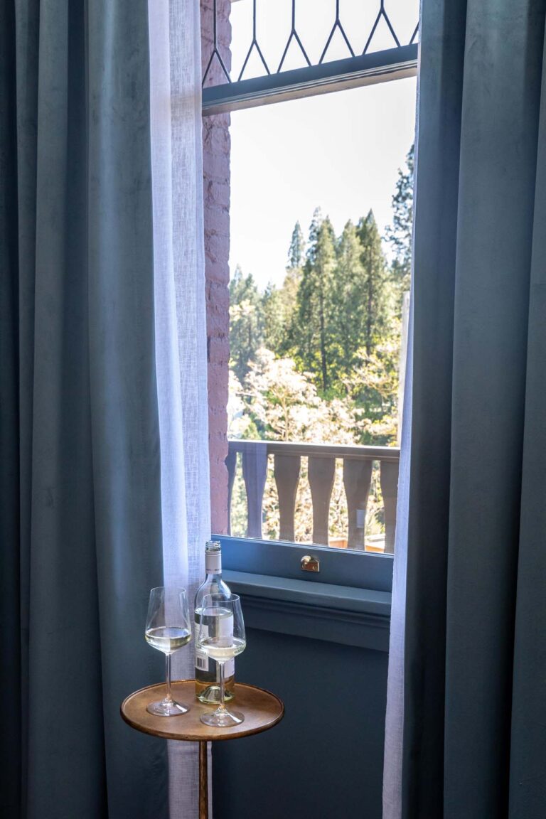 Window with view of forest at National Exchange Hotel